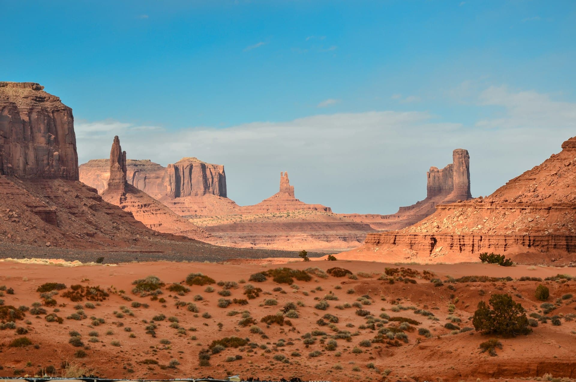 Desert road stretching into the horizon at golden hour